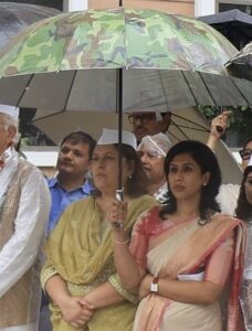 Dr shama mohd trolled by right wingers for holding an umbrella for Supriya Shrinate
